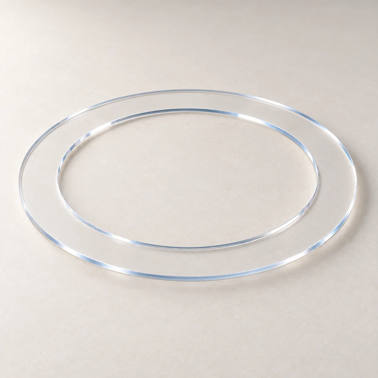 Product illustration of a thin, transparent quartz etching ring